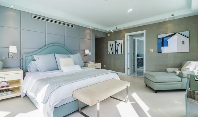 a bedroom with a bed and a couch