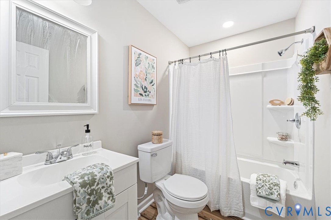 1989 Cox Road Blackstone, VA 23824 - Photo 17 of 44 Bathroom featuring shower / tub combo, vanity, and