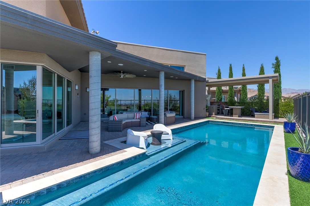 6014 Willow Ridge Court Las Vegas, NV 89135 - Photo 70 of 99 This outdoor oasis offers a refreshing pool and an inviting patio for relaxation and entertainment.