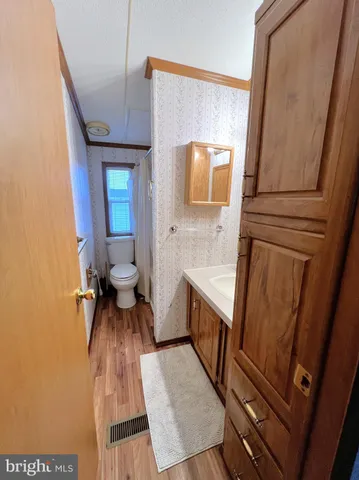 a view of kitchen with sink and a refrigerator