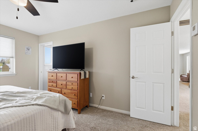 45 West 100 South Mendon, UT 84325 - Photo 23 of 64 Bedroom with light colored carpet and a ceiling fan