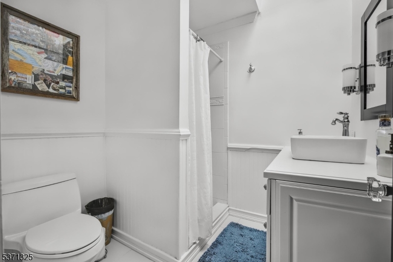 590 West Shore Trail Sparta, NJ 07871 - Photo 16 of 41 a bathroom with a toilet and a sink
