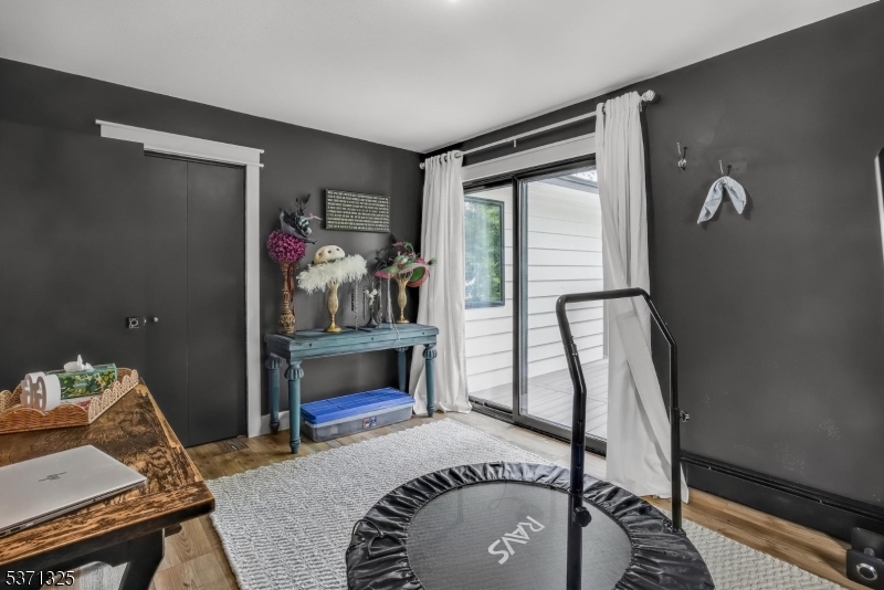 590 West Shore Trail Sparta, NJ 07871 - Photo 21 of 41 a bedroom with a bed and a table in it