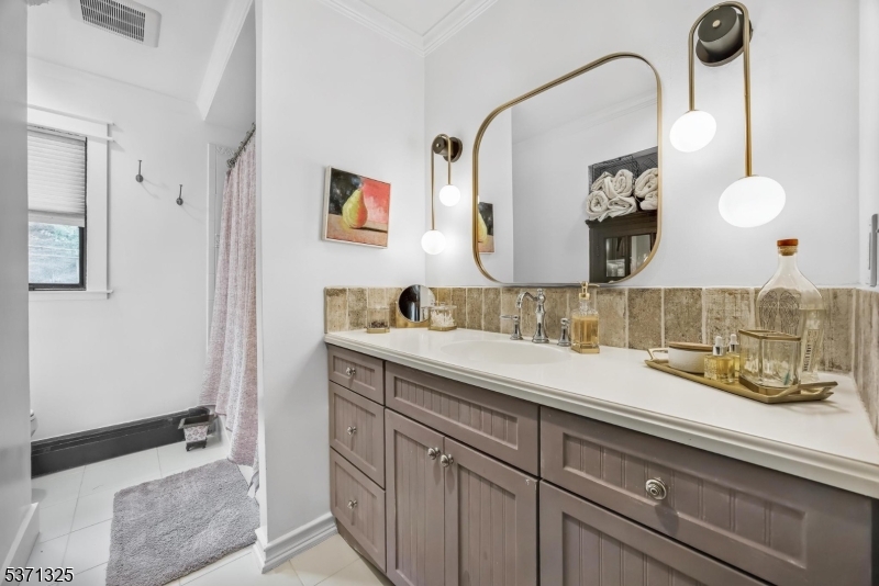 590 West Shore Trail Sparta, NJ 07871 - Photo 22 of 41 a bathroom with a sink and a mirror
