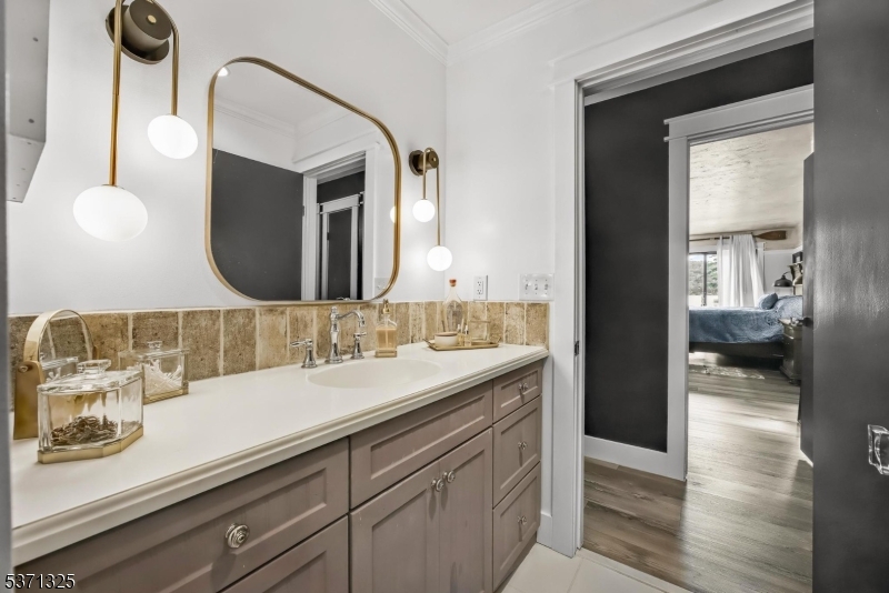 590 West Shore Trail Sparta, NJ 07871 - Photo 23 of 41 a bathroom with a sink and a mirror