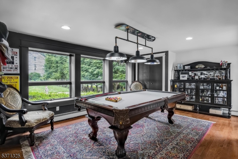 590 West Shore Trail Sparta, NJ 07871 - Photo 26 of 41 a living room with furniture a table and a large window