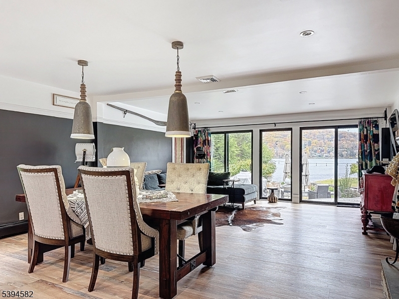 590 West Shore Trail Sparta, NJ 07871 - Photo 4 of 41 a view of a dining room with furniture window and wooden floor