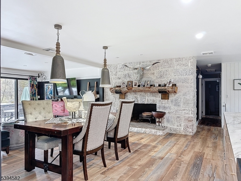 590 West Shore Trail Sparta, NJ 07871 - Photo 7 of 41 a dining room with furniture and wooden floor