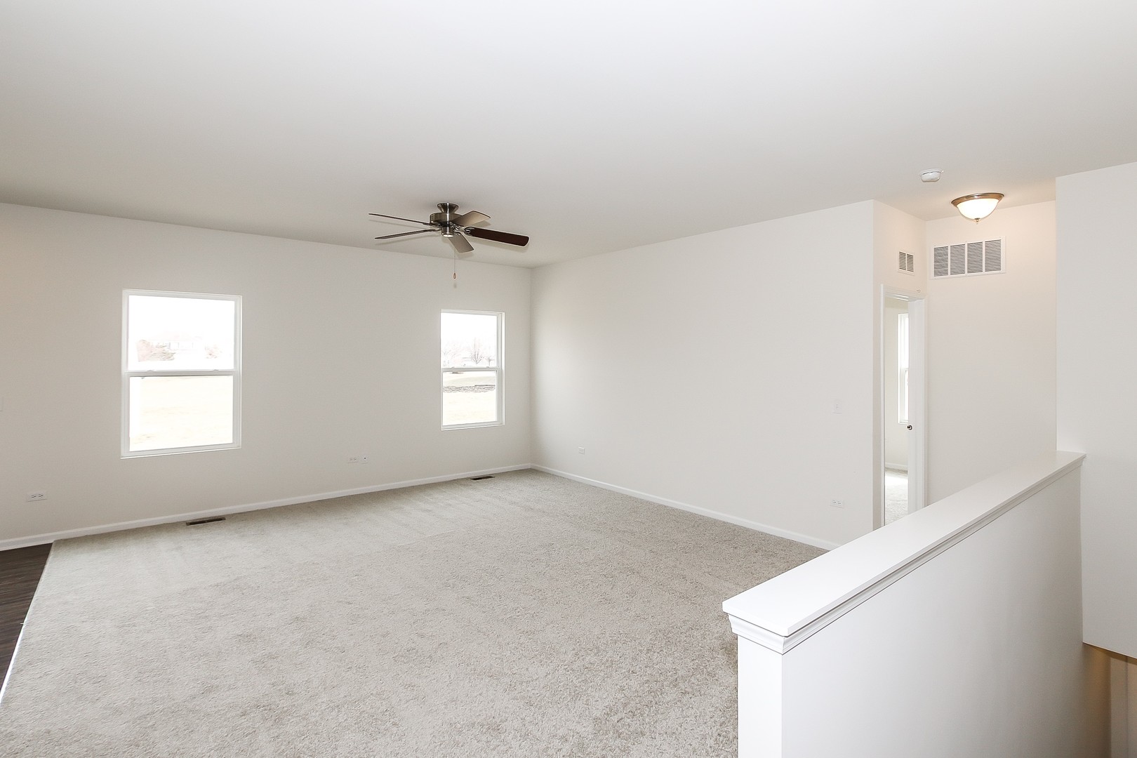 904 Sharp Drive, Unit 1593 Plano, IL 60545 - Photo 12 of 39 a view of an empty room with a window