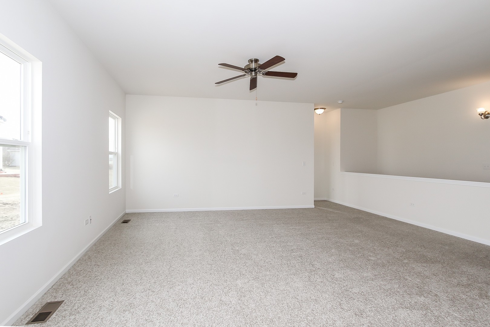904 Sharp Drive, Unit 1593 Plano, IL 60545 - Photo 16 of 39 a view of an empty room with a window