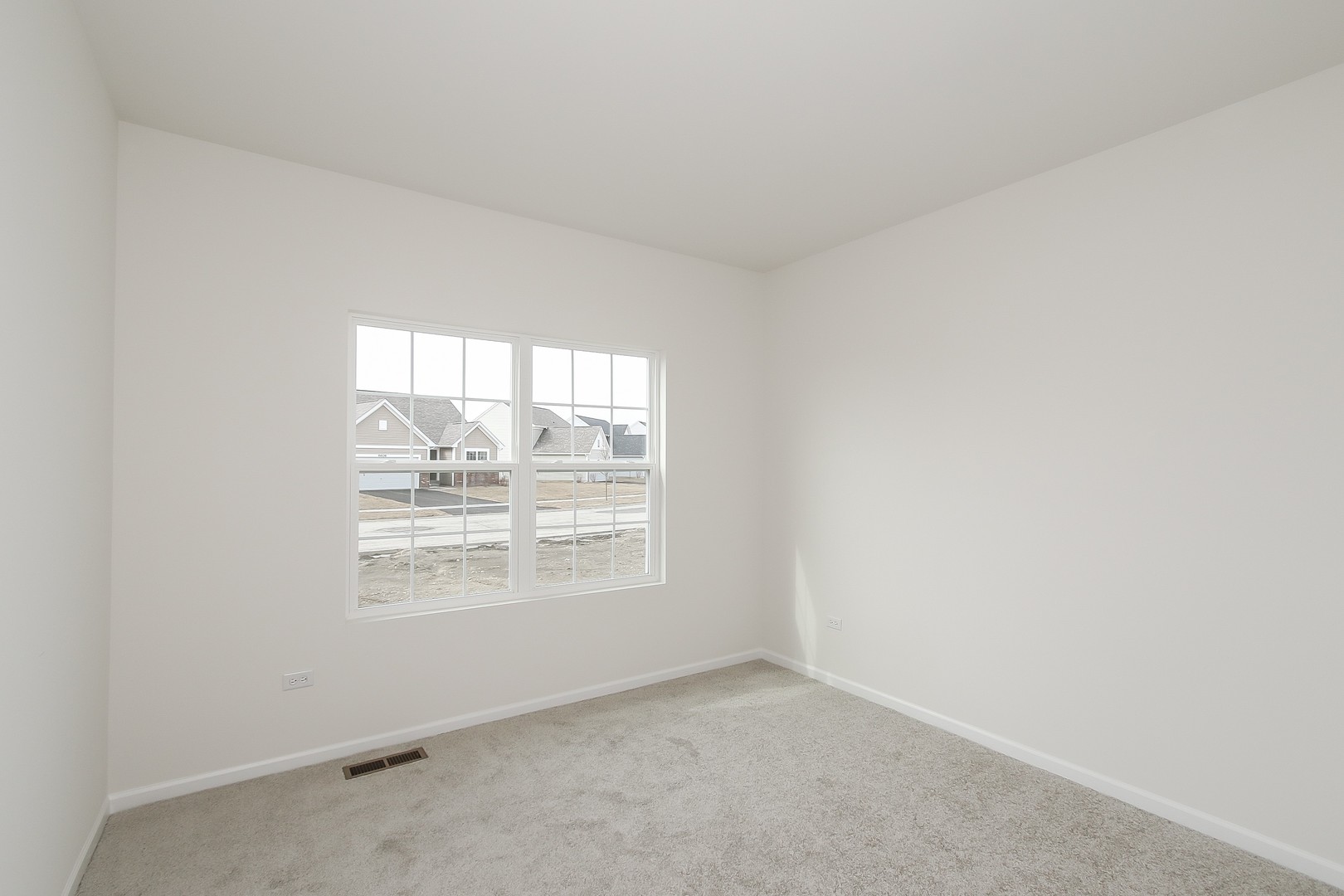 904 Sharp Drive, Unit 1593 Plano, IL 60545 - Photo 31 of 39 an empty room with windows