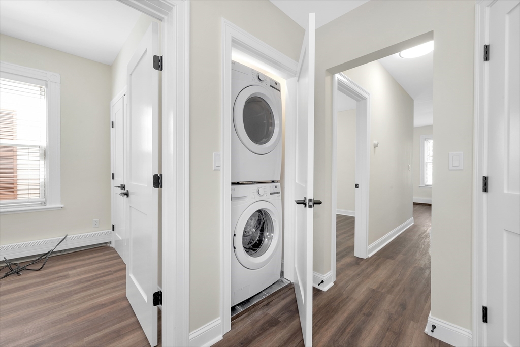 16 O Street, Unit 2 Boston, MA 02127 - Photo 5 of 19 a view of a hallway with washer and dryer