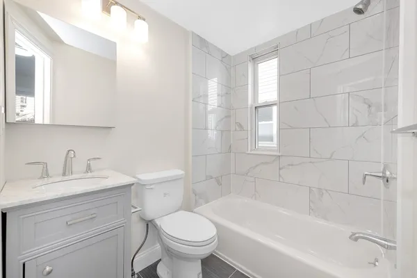 a bathroom with a sink toilet and bathtub