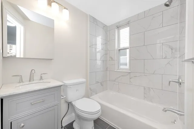 a bathroom with a sink toilet and bathtub