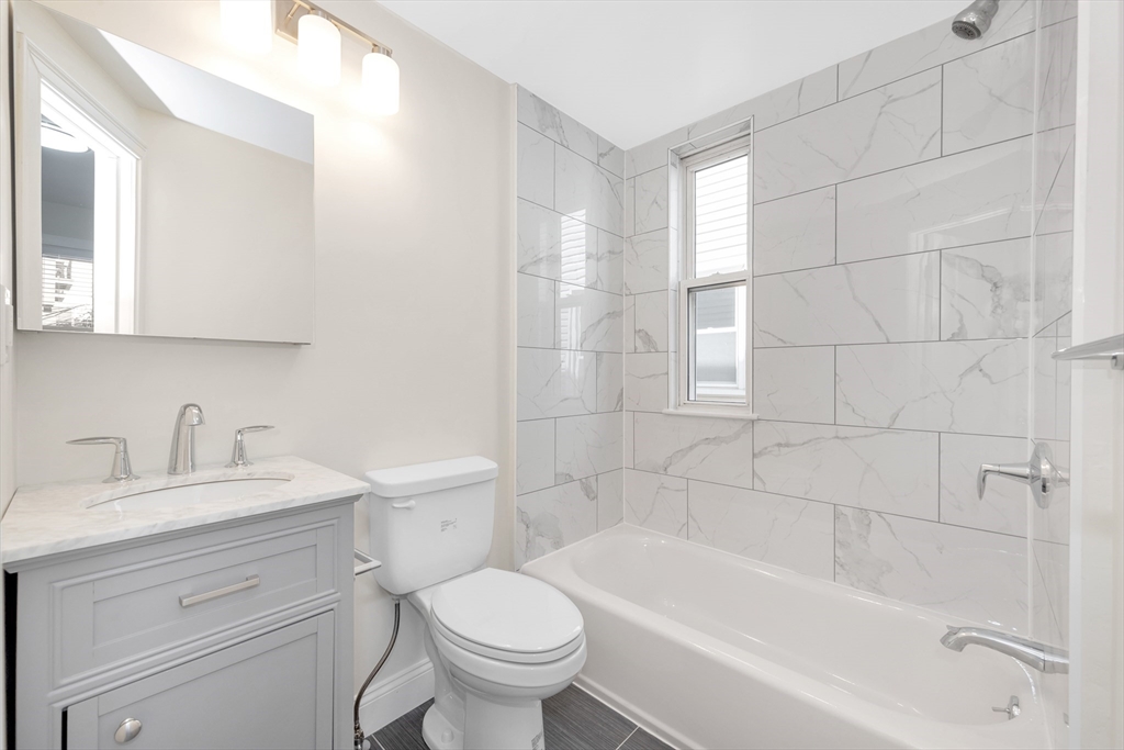 16 O Street, Unit 2 Boston, MA 02127 - Photo 9 of 19 a bathroom with a sink toilet and bathtub