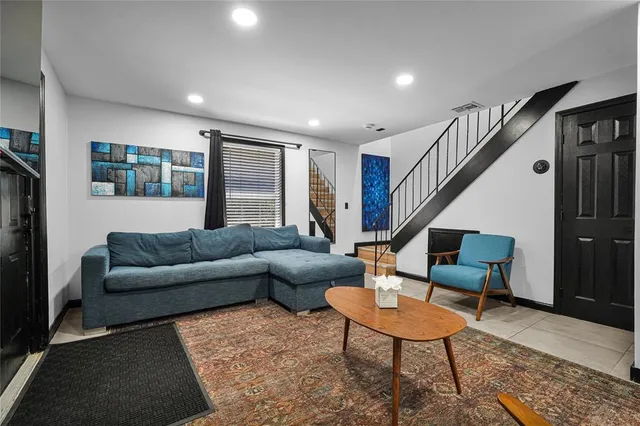a kitchen with stainless steel appliances kitchen island granite countertop a stove and a sink