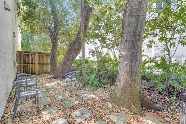 a kitchen with granite countertop a stove and a refrigerator