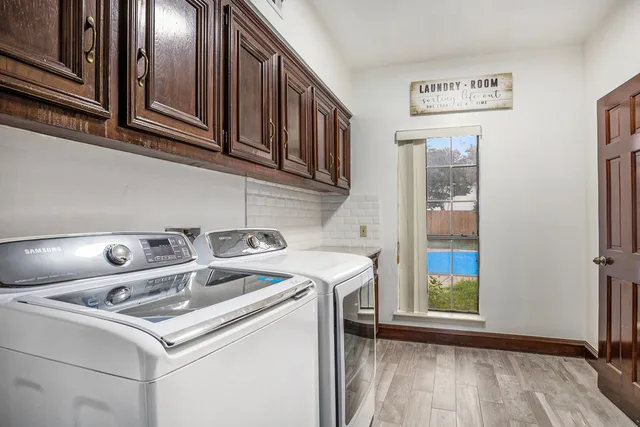 a utility room with dryer and washer