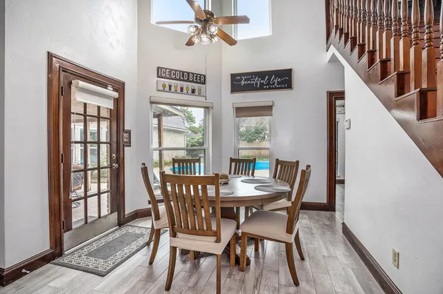 a view of a dining room with furniture window and wooden floor