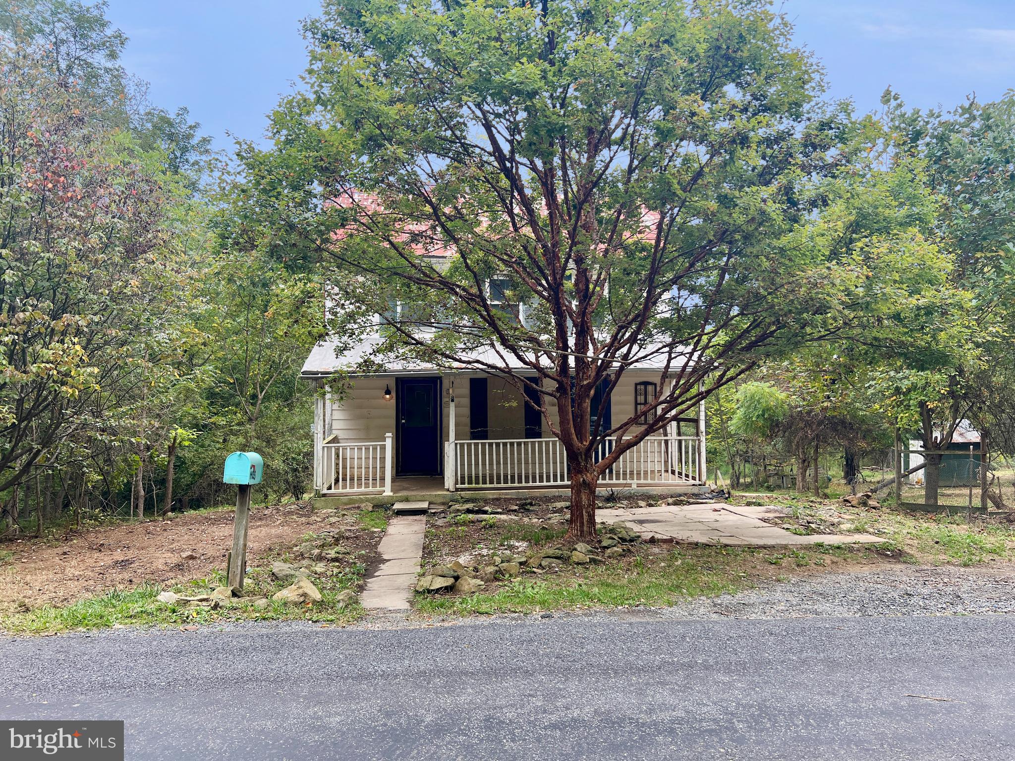 14035 Brown Road Smithsburg, MD 21783 - Photo 4 of 71 a front view of a house with garden and trees