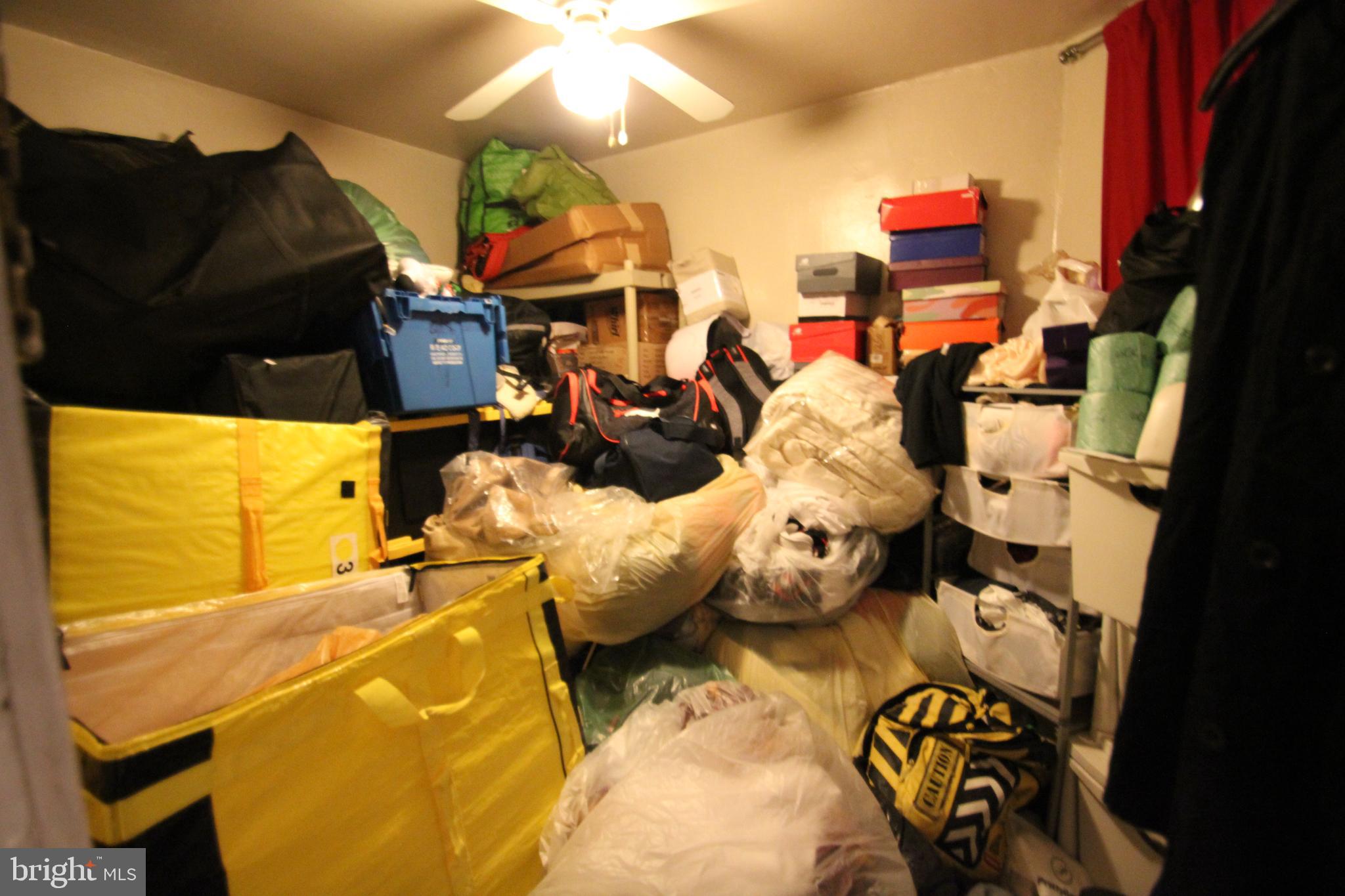 5747 Belmar Street Philadelphia, PA 19143 - Photo 13 of 13 a bed room with a bed and a night stand