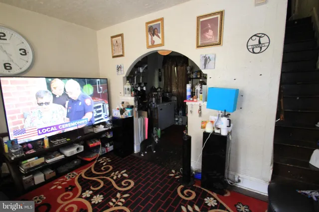 a room with furniture and screen equipment