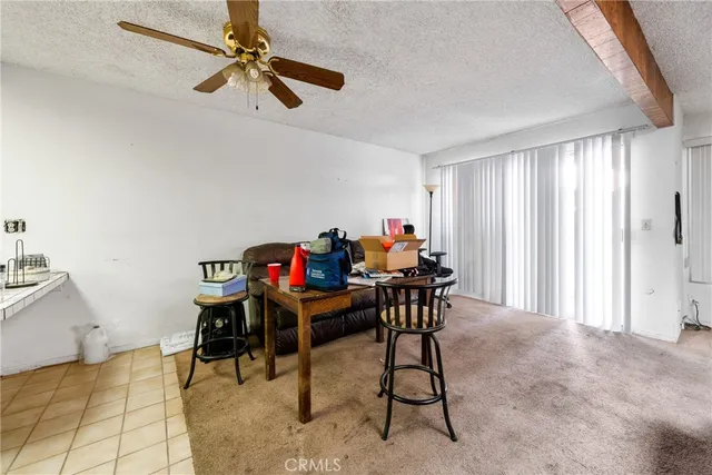 a work room with furniture and a window