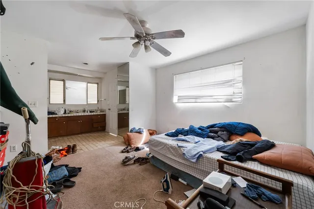 a bedroom with a workspace