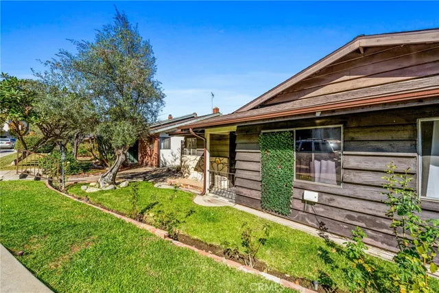 front view of a house with a yard