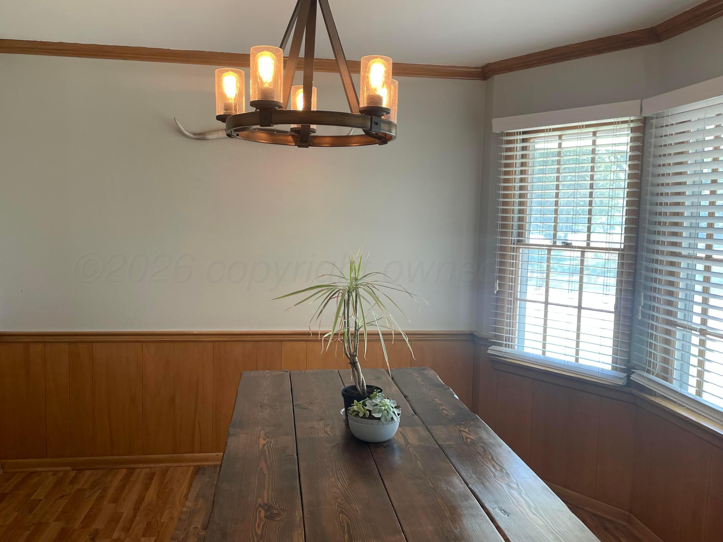 6200 Hanson Road Amarillo, TX 79106 - Photo 4 of 27 a view of dining room with wooden floor and chandelier