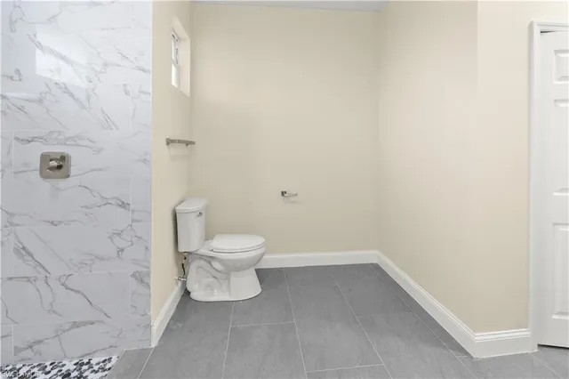 a bathroom with a granite countertop sink and vanity