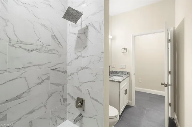 a view of a small space with wooden floor and a window