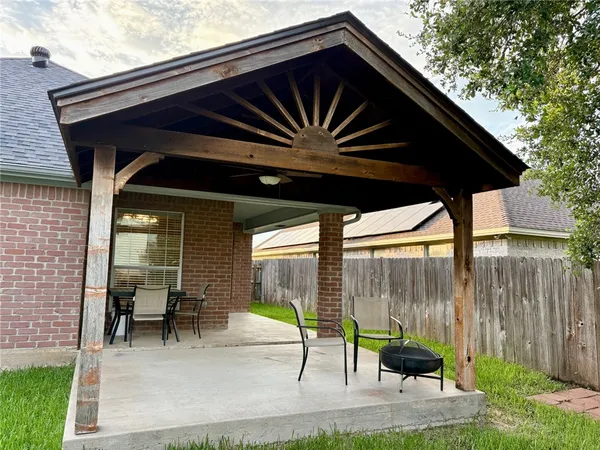 a backyard of a house with seating space
