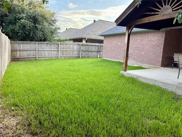 a view of a backyard with a garden