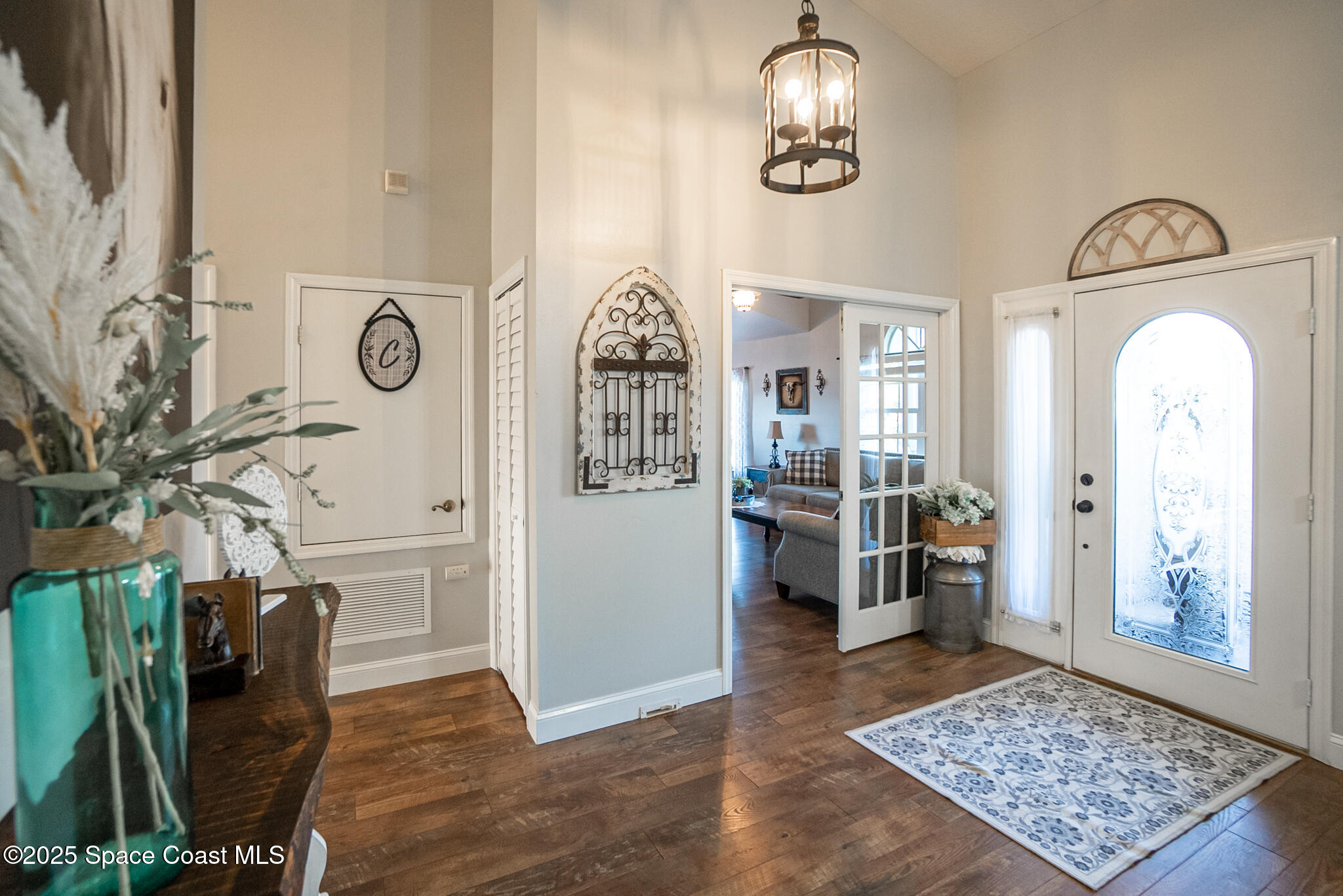 1868 Druliner Road St. Cloud, FL 34771 - Photo 16 of 57 a view of a hallway with furniture and a chandelier