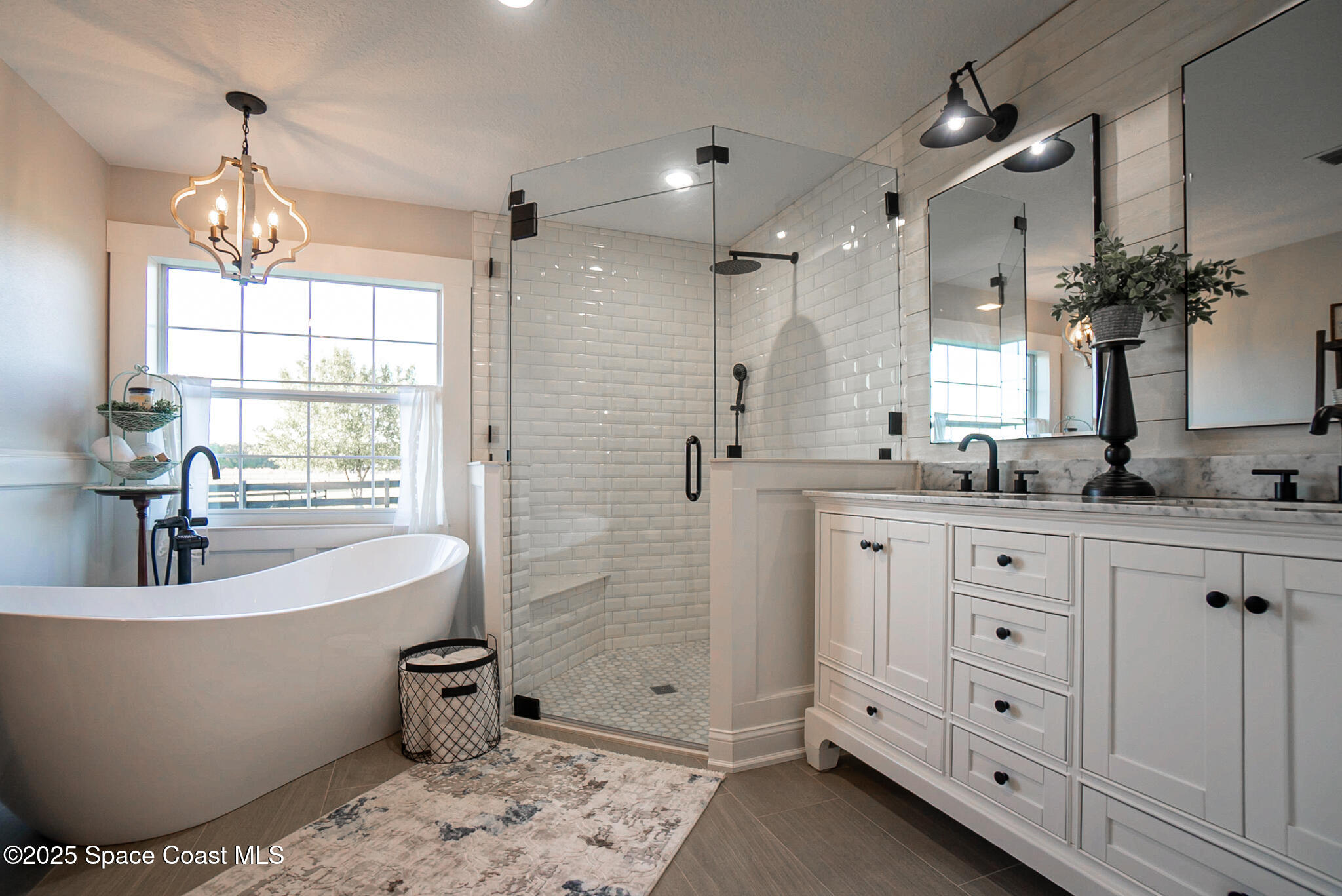 1868 Druliner Road St. Cloud, FL 34771 - Photo 23 of 57 a large spacious bathroom with a bathtub sink and mirror