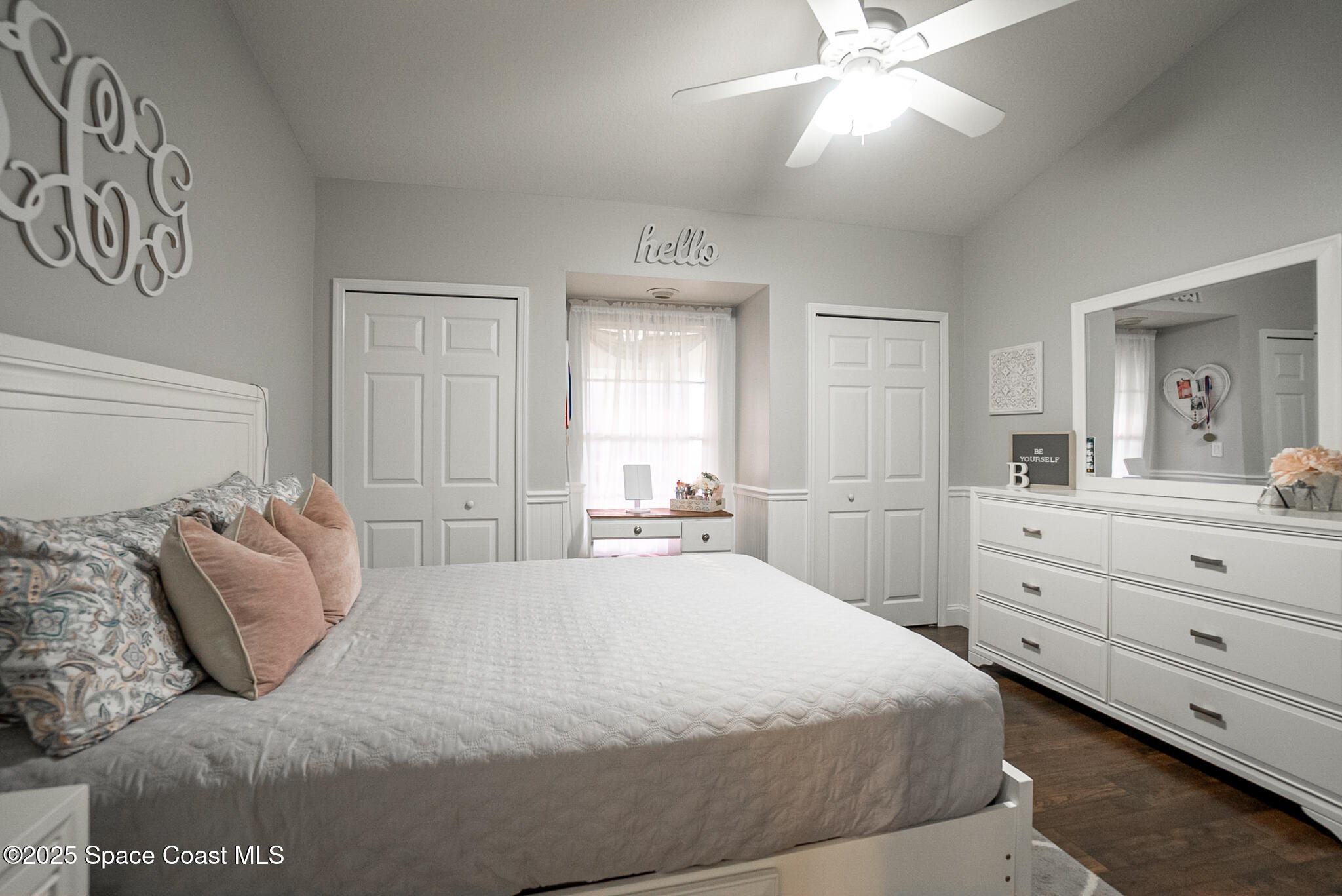 1868 Druliner Road St. Cloud, FL 34771 - Photo 31 of 57 a bedroom with a large bed and a chandelier