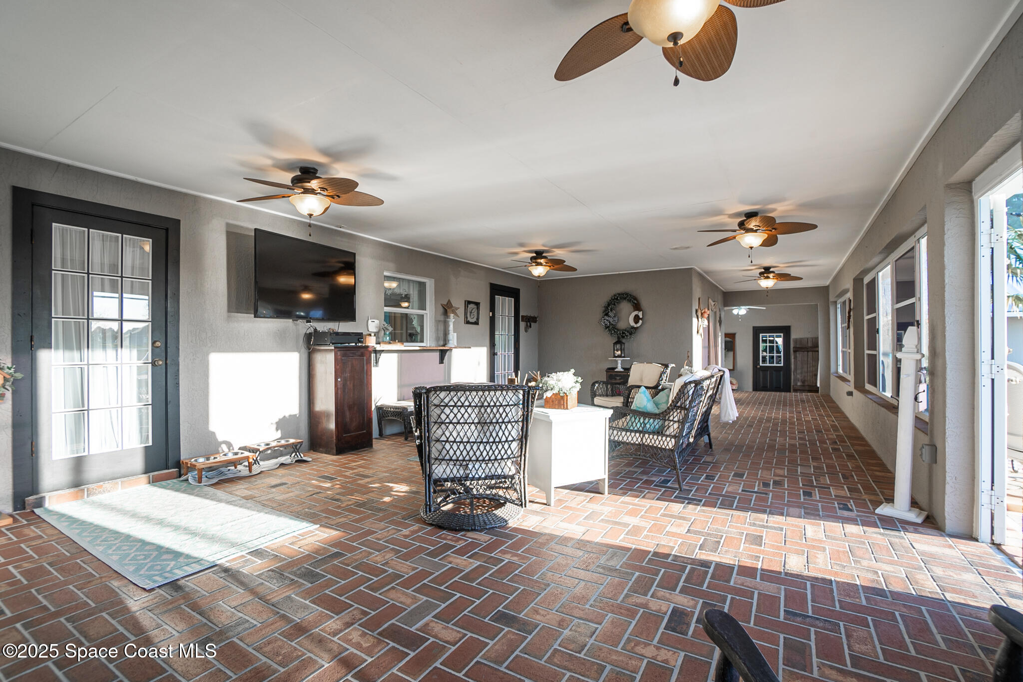 1868 Druliner Road St. Cloud, FL 34771 - Photo 39 of 57 a living room with furniture and a flat screen tv
