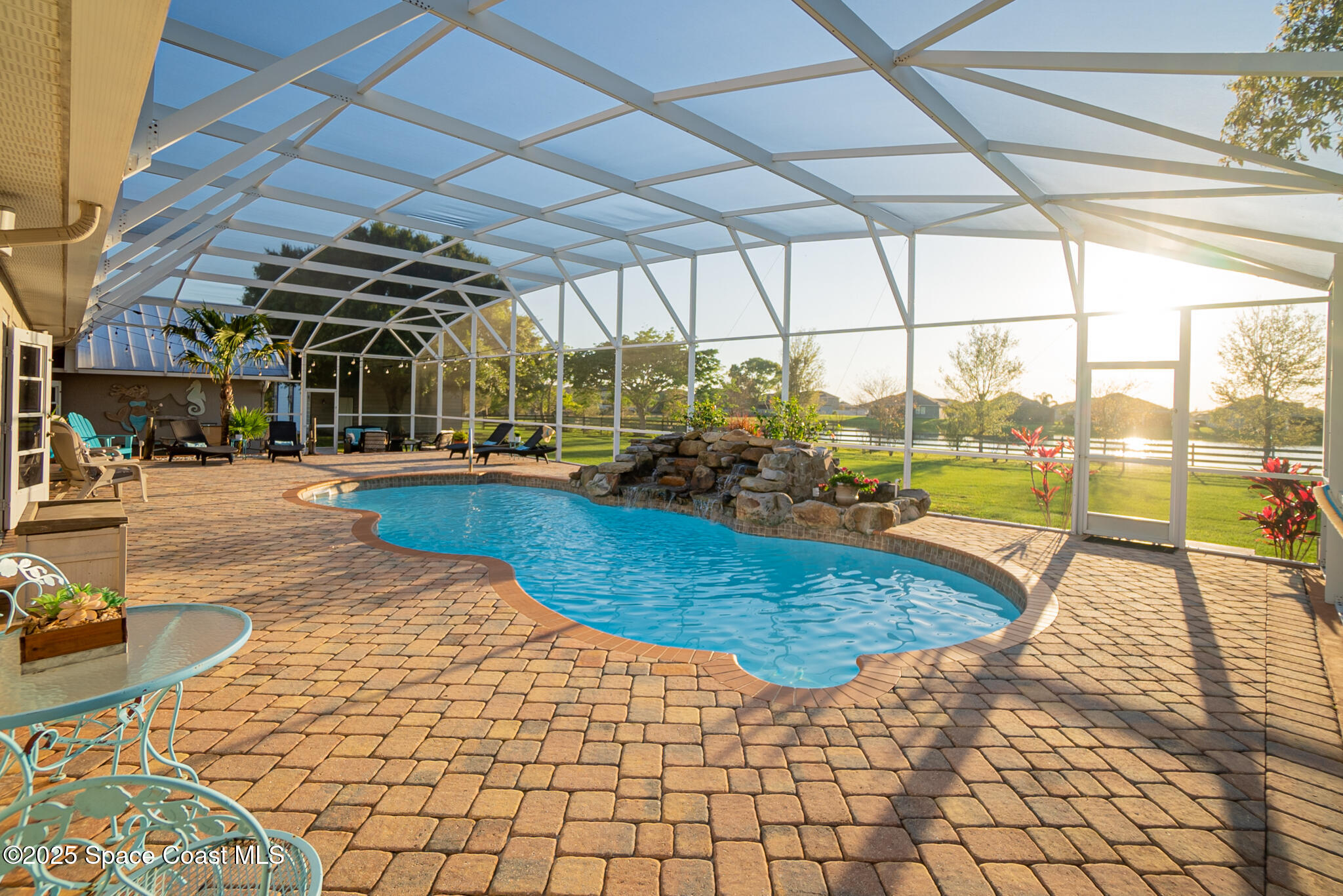 1868 Druliner Road St. Cloud, FL 34771 - Photo 45 of 57 a view of a swimming pool with a porch