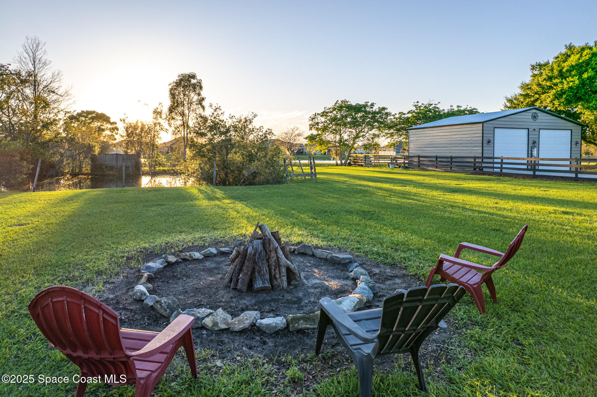 1868 Druliner Road St. Cloud, FL 34771 - Photo 52 of 57 a view of a swimming pool and lounge chairs in back yard of the house