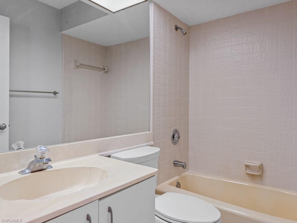 7016 Trail Boulevard Naples, FL 34108 - Photo 18 of 26 a bathroom with a sink toilet and shower