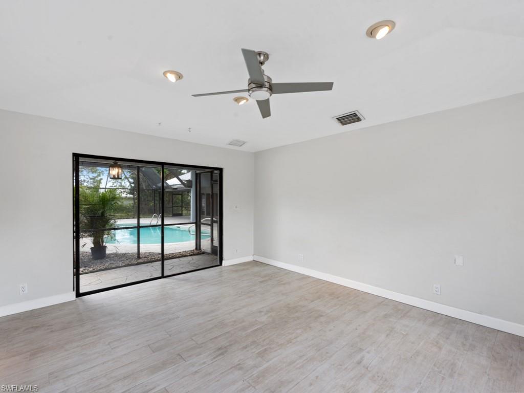 7016 Trail Boulevard Naples, FL 34108 - Photo 24 of 26 an empty room with sliding door