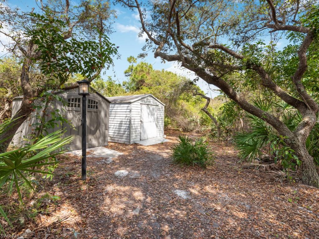7016 Trail Boulevard Naples, FL 34108 - Photo 25 of 26 a view of a house with a tree