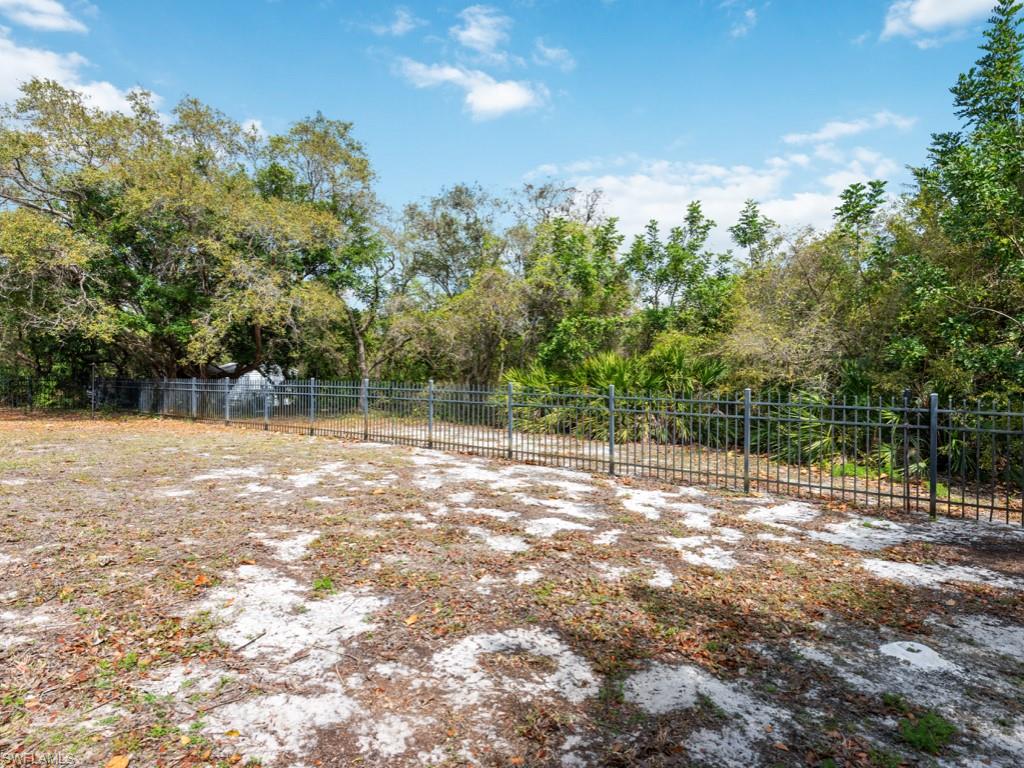 7016 Trail Boulevard Naples, FL 34108 - Photo 26 of 26 a view of a yard with a tree