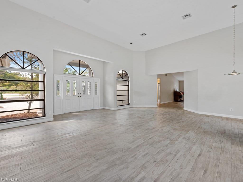 7016 Trail Boulevard Naples, FL 34108 - Photo 7 of 26 a view of a livingroom with furniture and window