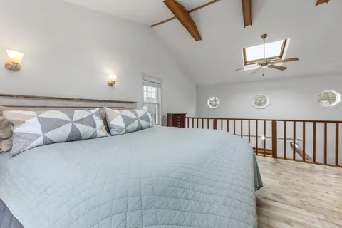 a large white bed in a white room