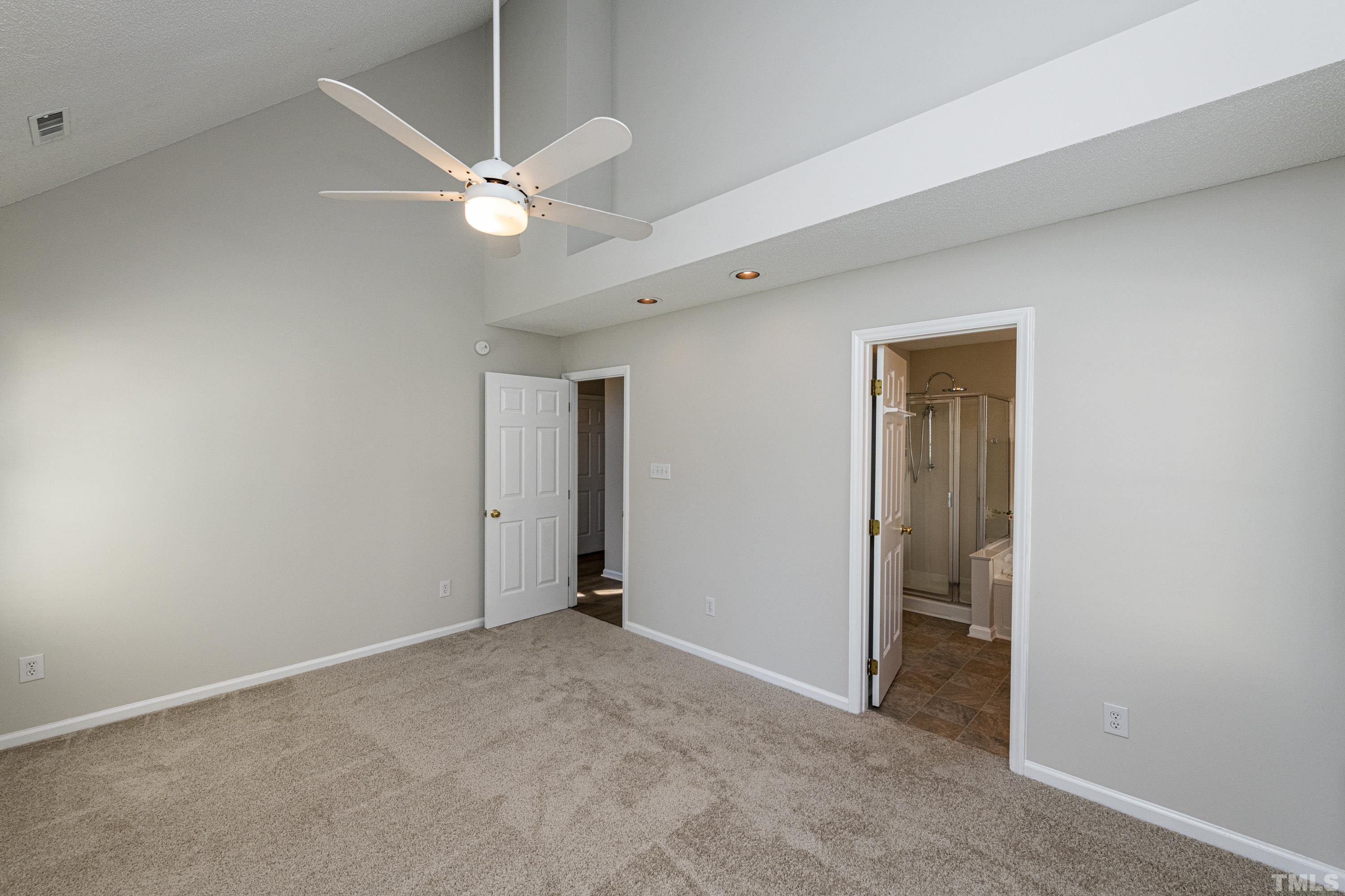 5317 Tilford Lane Raleigh, NC 27613 - Photo 16 of 29 an empty room with a fan and a fan