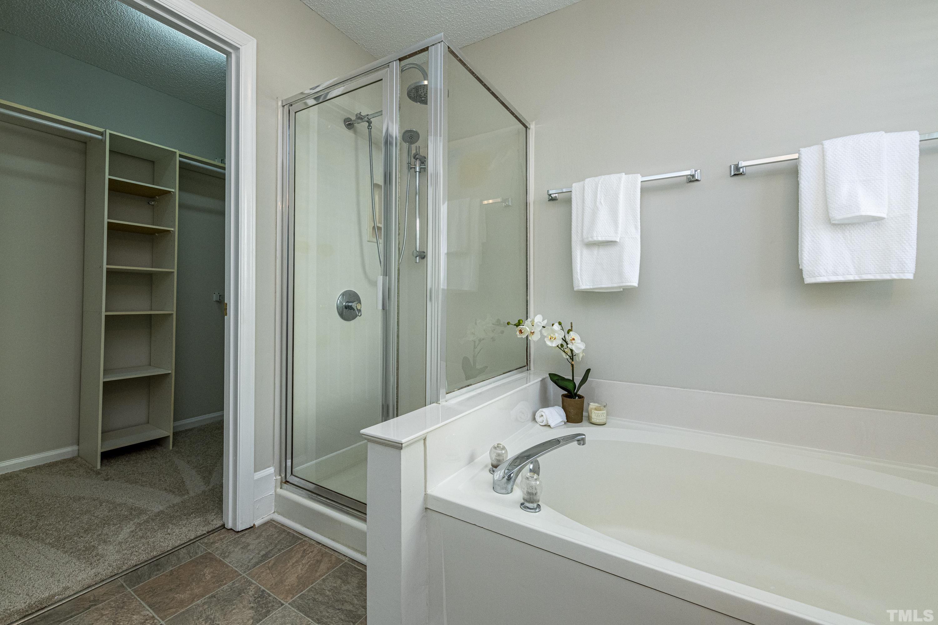 5317 Tilford Lane Raleigh, NC 27613 - Photo 20 of 29 a white bath tub sitting next to a shower