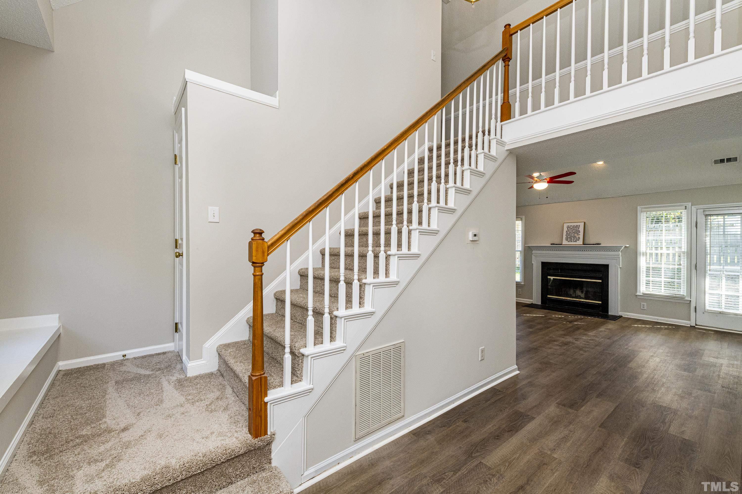 5317 Tilford Lane Raleigh, NC 27613 - Photo 21 of 29 a view of entryway and hall with wooden floor