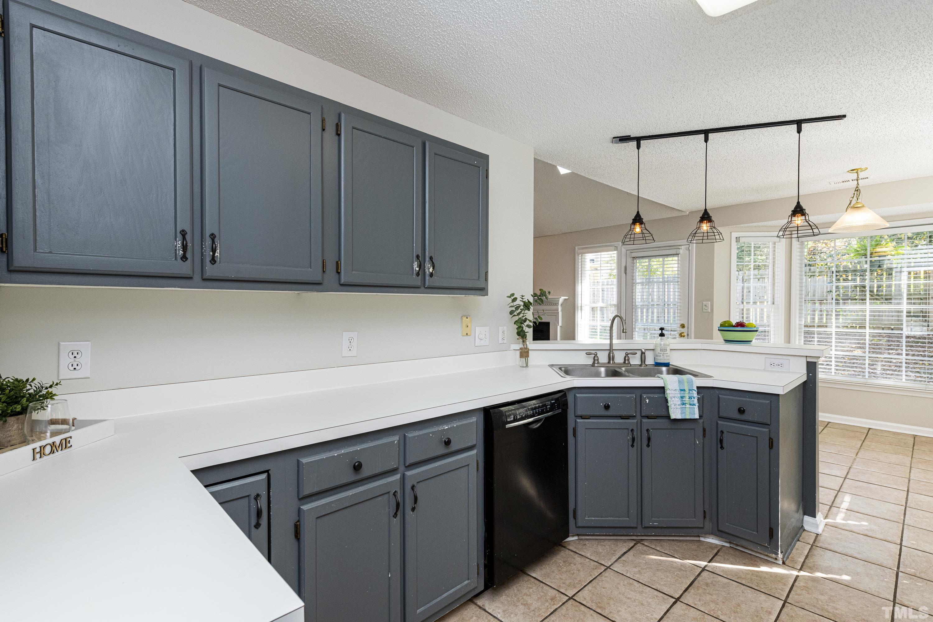 5317 Tilford Lane Raleigh, NC 27613 - Photo 5 of 29 a kitchen with a sink and cabinets
